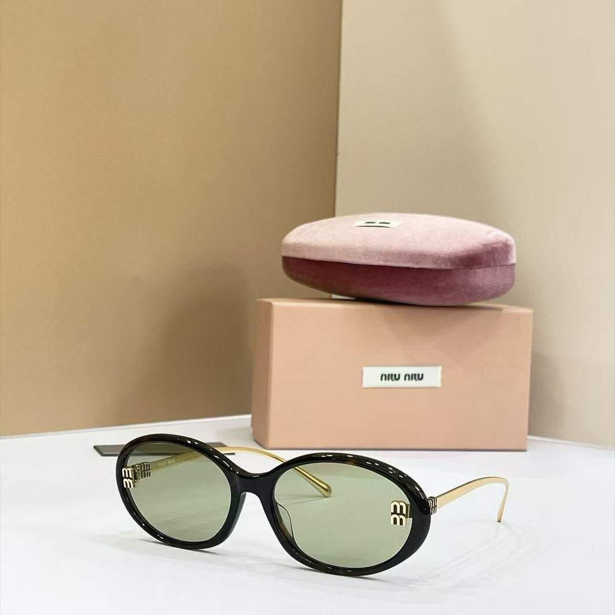 Miu Miu Oval Sunglasses - 